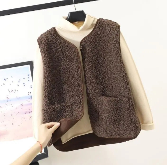 Women's cozy textured khaki fleece vest, perfect for stylish warmth and fall layering.
