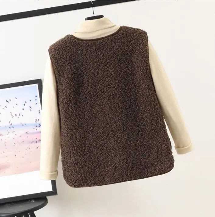 Stylish beige textured fleece vest for women, a cozy sleeveless jacket ideal for casual wear & winter layering.
