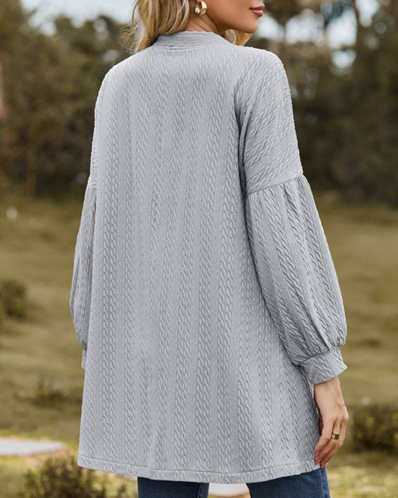 Comfortable women's fashion cardigan. Textured knit fabric and stylish lantern sleeves for a modern cozy look.