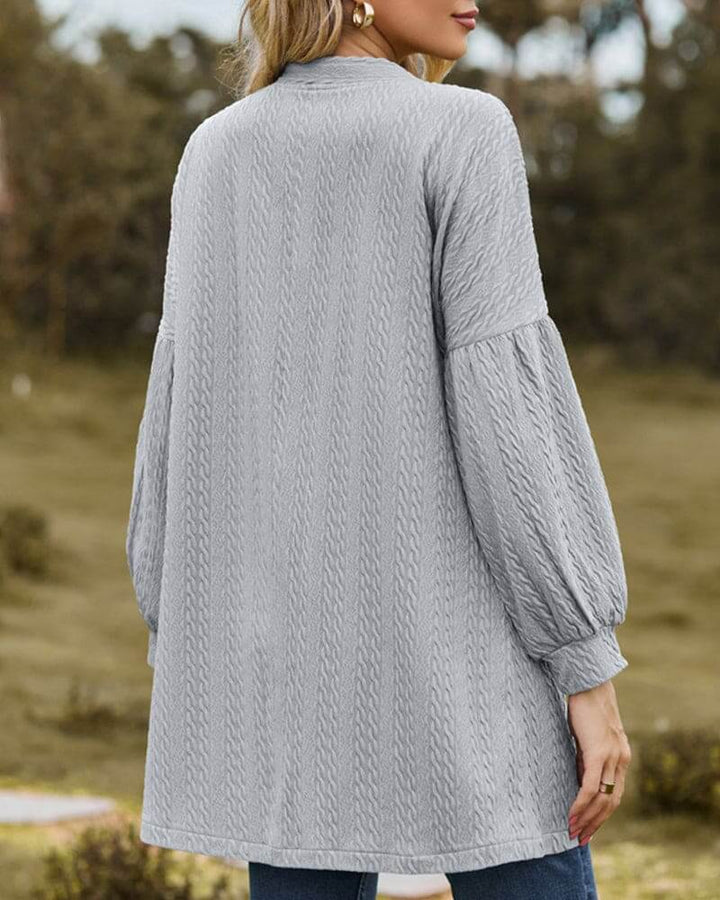 Comfortable women's fashion cardigan. Textured knit fabric and stylish lantern sleeves for a modern cozy look.