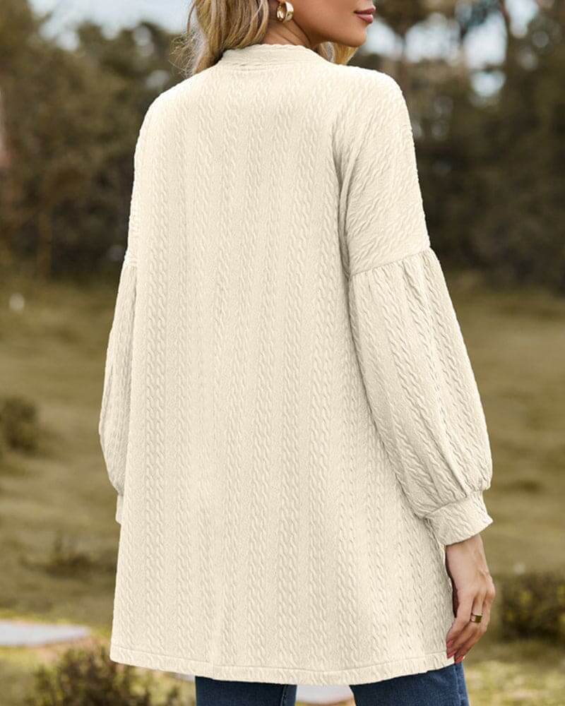 Fashionable women's cardigan with unique lantern sleeves and a cozy textured knit, ideal for versatile styling.