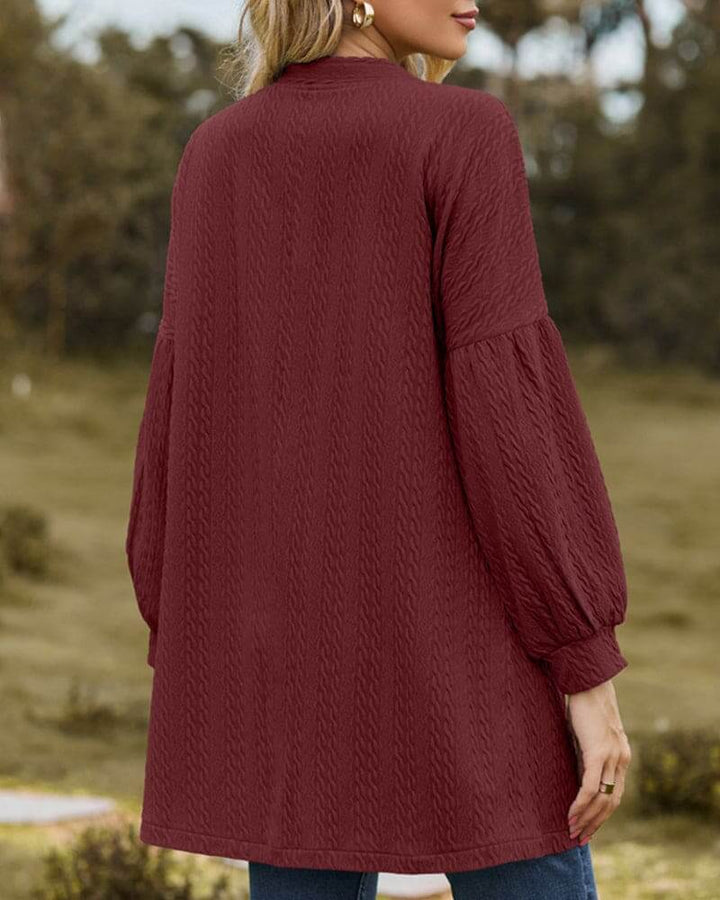 Women's cozy textured sweater cardigan with trendy lantern sleeves, ideal for comfortable and stylish layering.