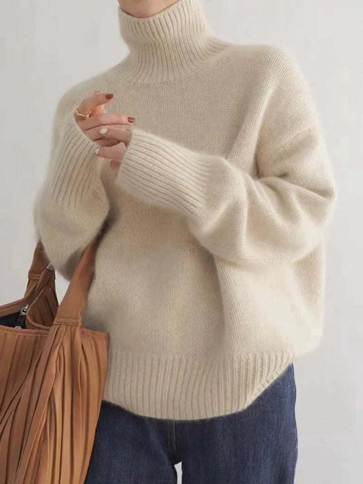 Warm beige women's cozy turtleneck sweater, a comfortable long sleeve pullover for everyday winter wear.