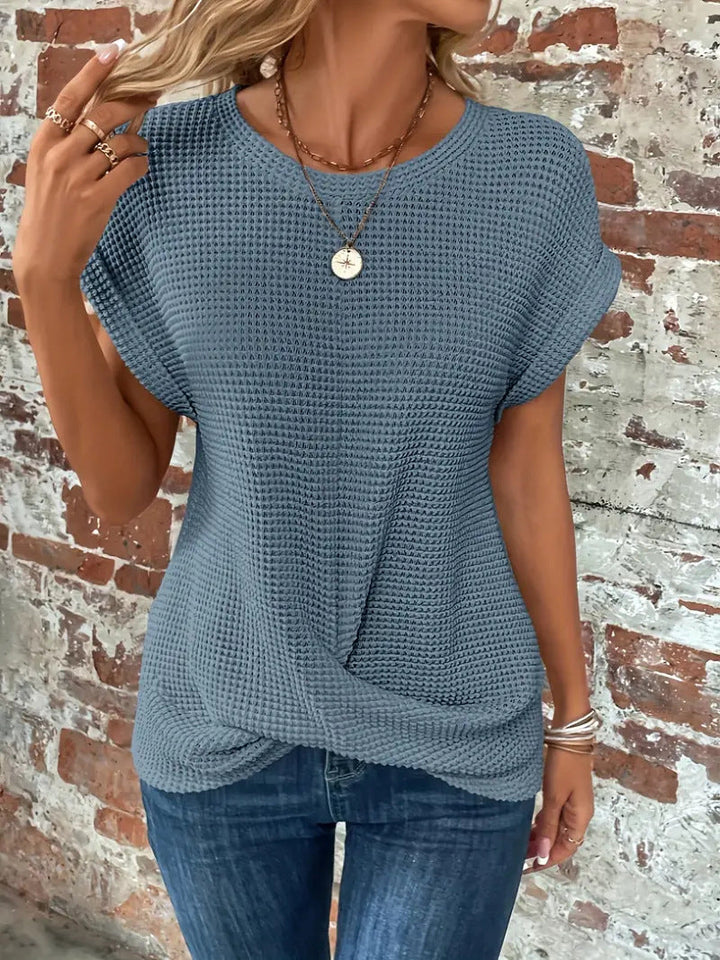 Women's solid color waffle knit long sleeve tee. Breathable & comfortable casual top with a relaxed fit.
