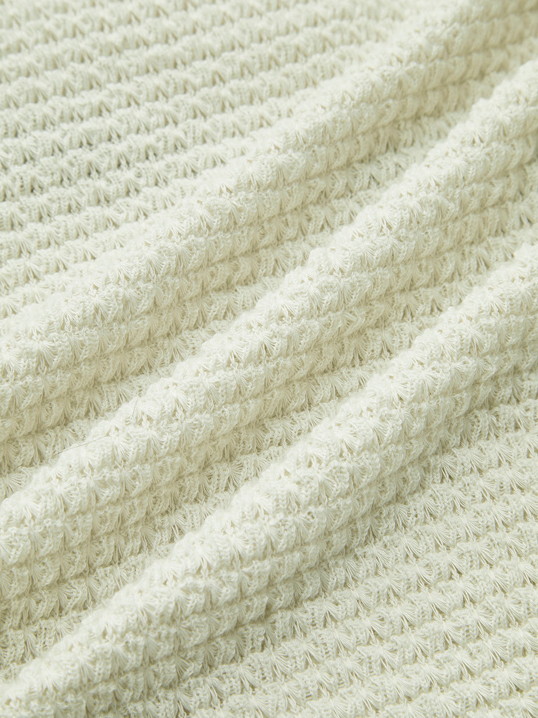 Versatile women's long sleeve waffle knit top. Perfect for layering or as a standalone casual piece.