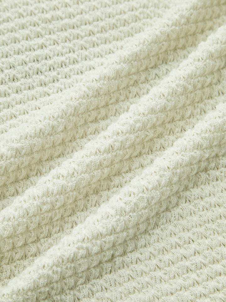 Versatile women's long sleeve waffle knit top. Perfect for layering or as a standalone casual piece.