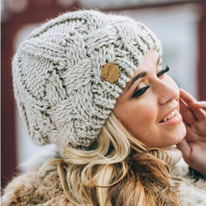 Women's cozy warm knitted winter hat, perfect for cold weather comfort and stylish winter fashion.