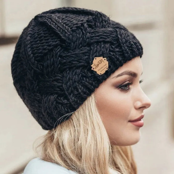 Soft knit women's beanie, a stylish fashion accessory for ultimate warmth and comfort in winter.