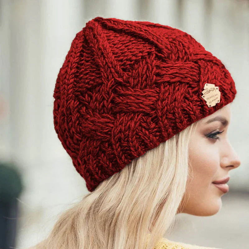 Soft knit women's winter beanie, a warm and cozy fashion accessory perfect for chilly outdoor days.