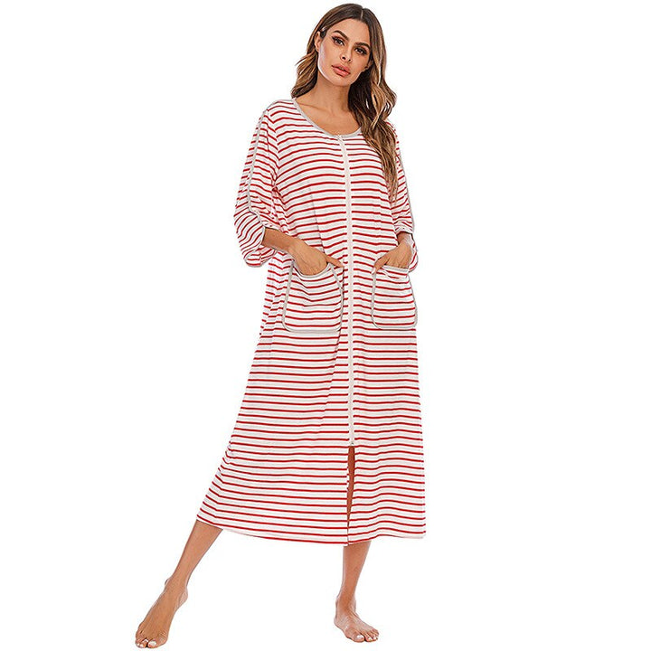 Warm women's mid-length hooded nightdress, full zip & pockets for cozy winter evenings.