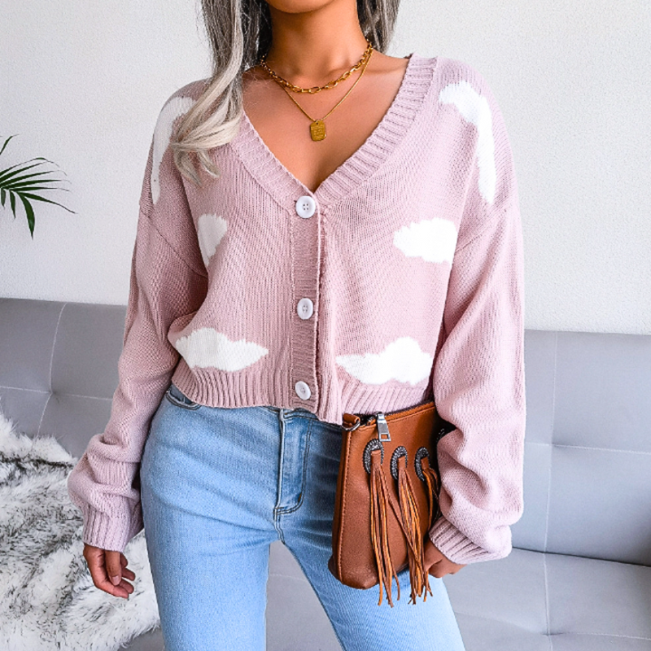 Comfortable cloud print cropped cardigan for women. V-neck, button-up, unique design.