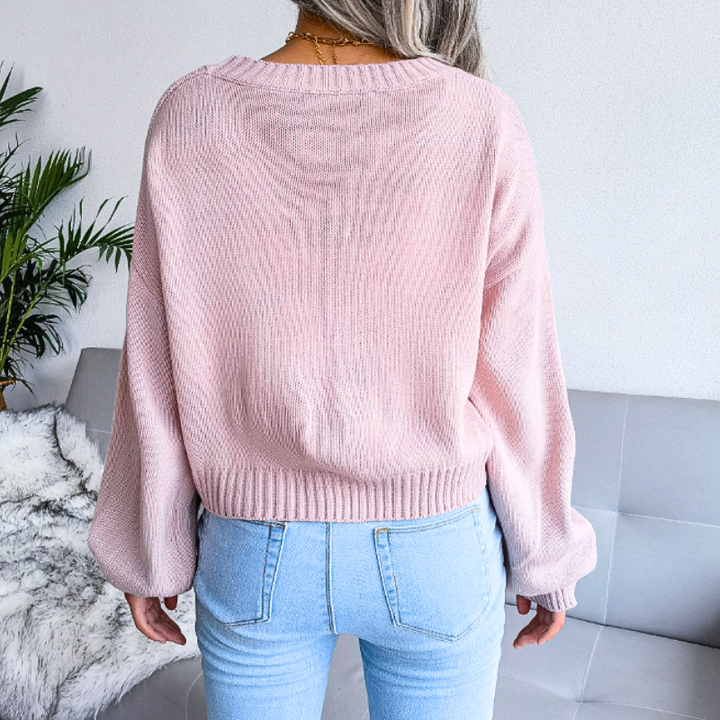 Pink cropped cloud print V-neck cardigan. Women's casual fashion top, perfect for spring style.