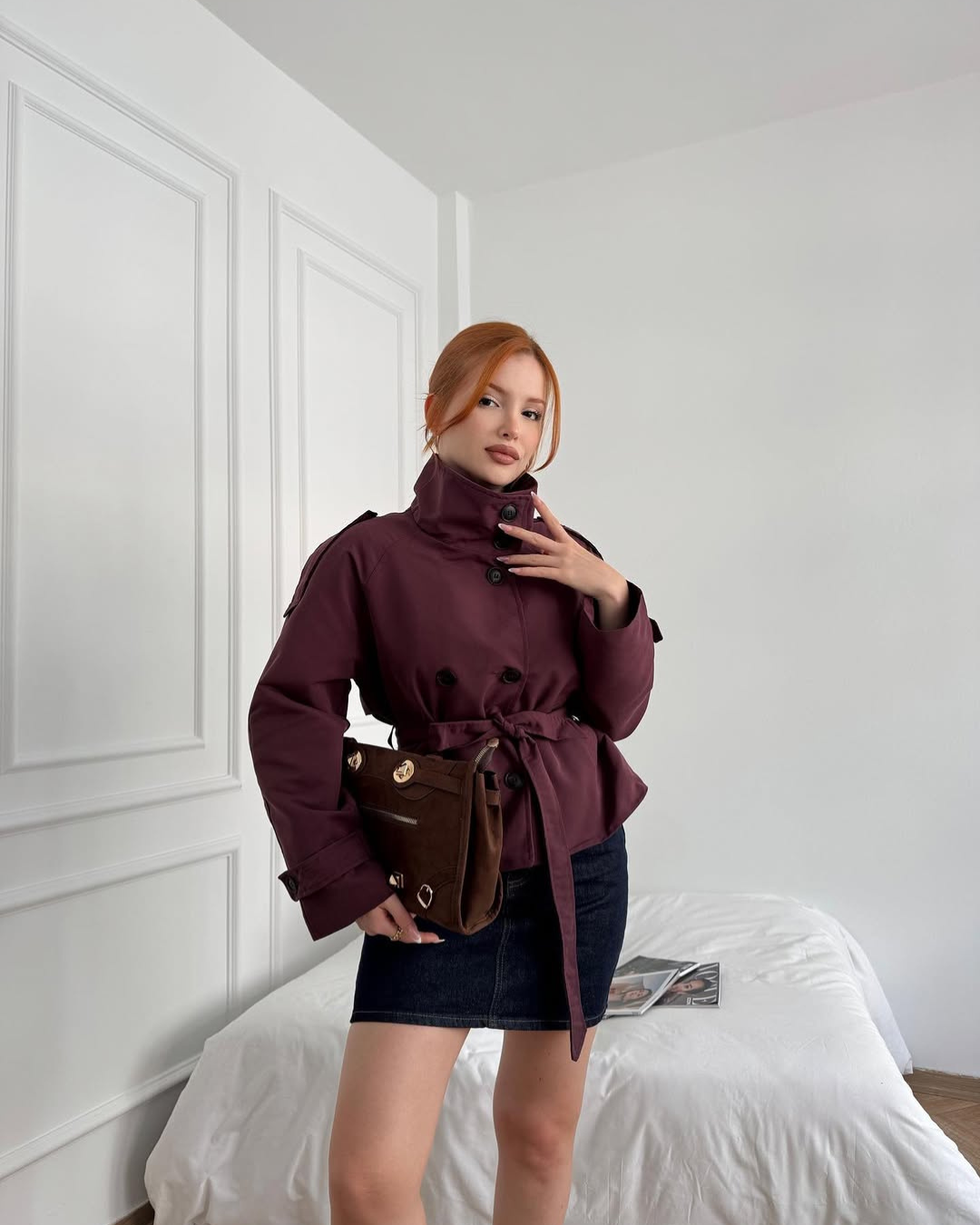 Timeless women's cropped trench coat, classic double-breasted belted design, elegant.