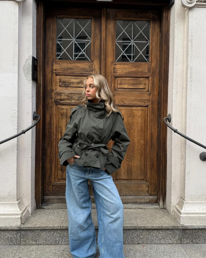 Women's stylish cropped trench coat, ideal fall/winter outerwear, belted classic design.