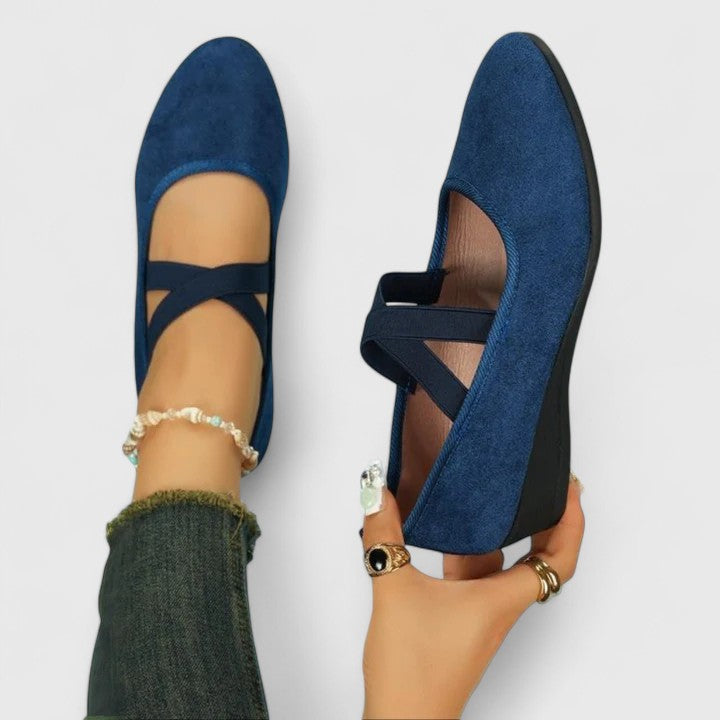 Comfortable women's ballet flats with cross straps. Stylish slip-on shoes for casual wear & everyday elegance.