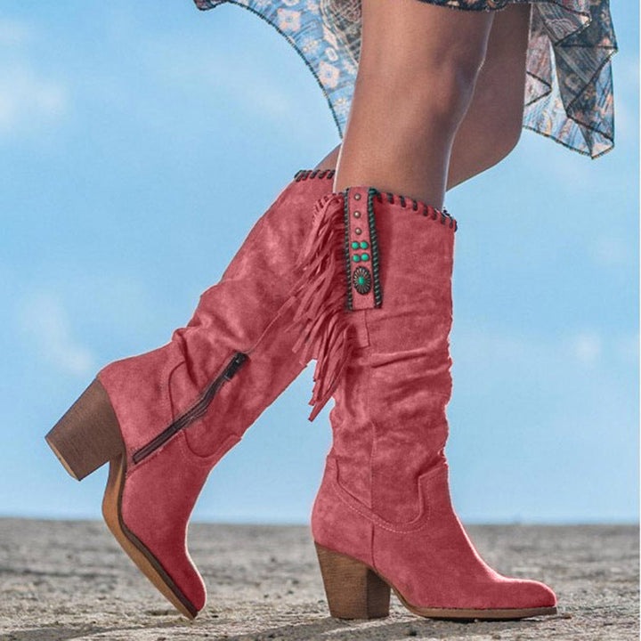 Dakota women's knee-high western boots featuring studded accents, fringe detail, pointed toe & block heel.