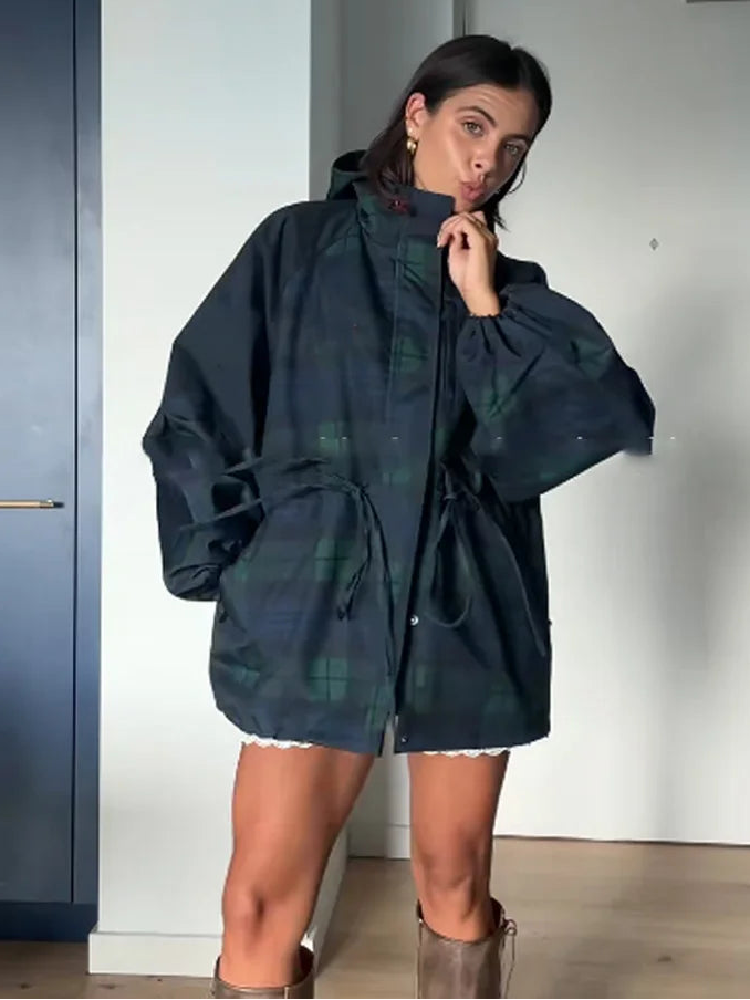 Comfortable women's dark blue plaid hooded jacket. Oversized fit with a practical hood, ideal for transitional weather.