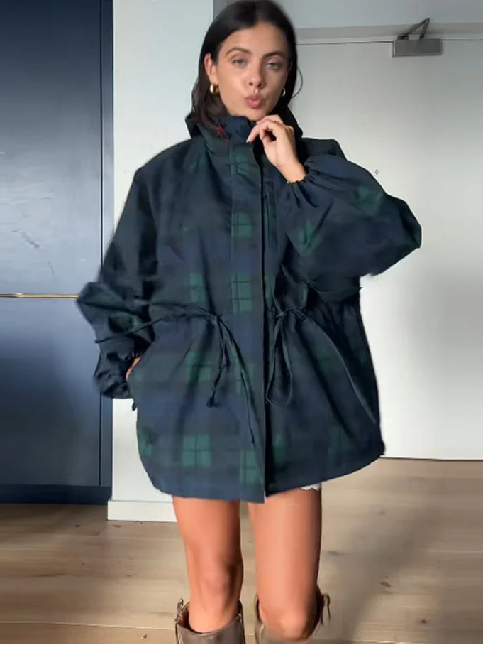 Stylish women's oversized plaid jacket in dark blue, featuring an adjustable drawstring waist for a customized fit.