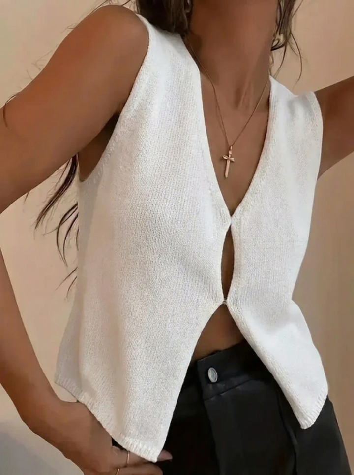 Women's deep V-neck sleeveless knit vest, a chic and modern layering staple for versatile fashion.