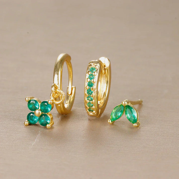 Hypoallergenic surgical steel ear piercing set with various studs & hoops for women's sensitive ears.