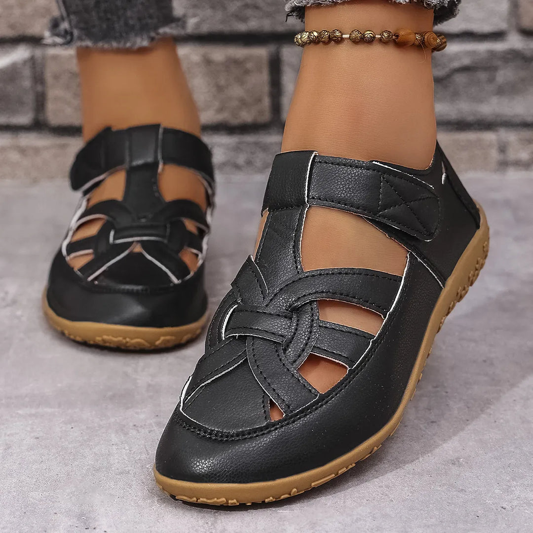 Stylish ladies' cutout sandals featuring adjustable Velcro straps and an open toe, perfect for summer.