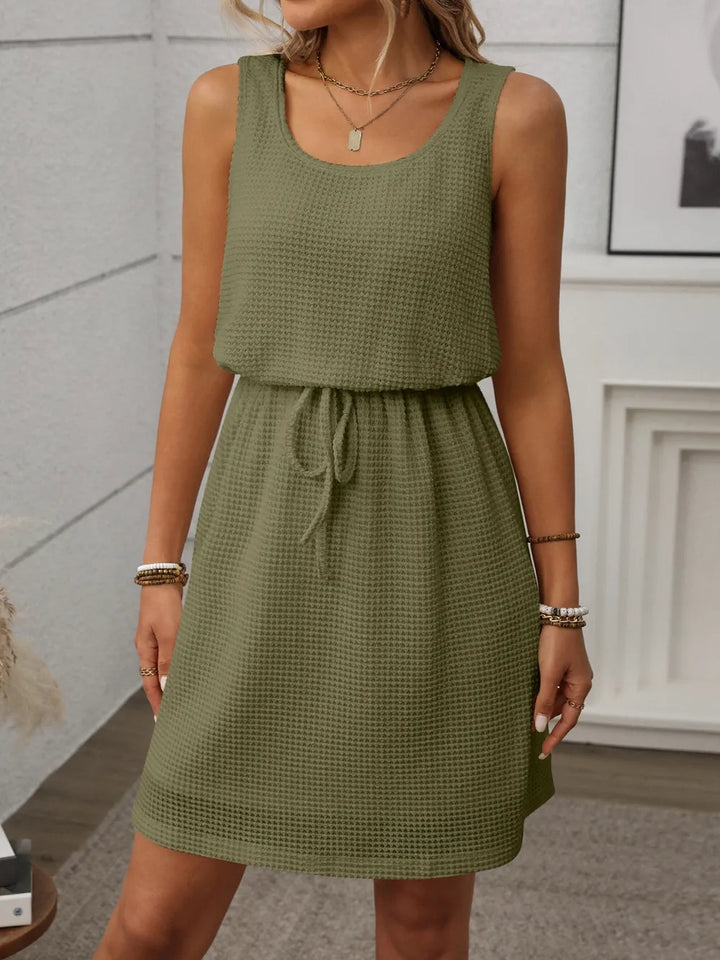 Effortless women's mini tank dress, ideal for summer comfort, vacation, and beach coverup.