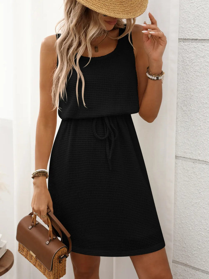 Sleeveless drawstring mini dress, offering ultimate summer comfort and effortless women's style.