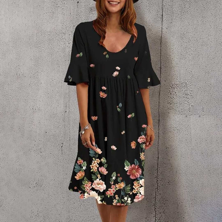 Flowy polyester floral midi dress for women with a flattering v-neck, ideal for summer beach days.