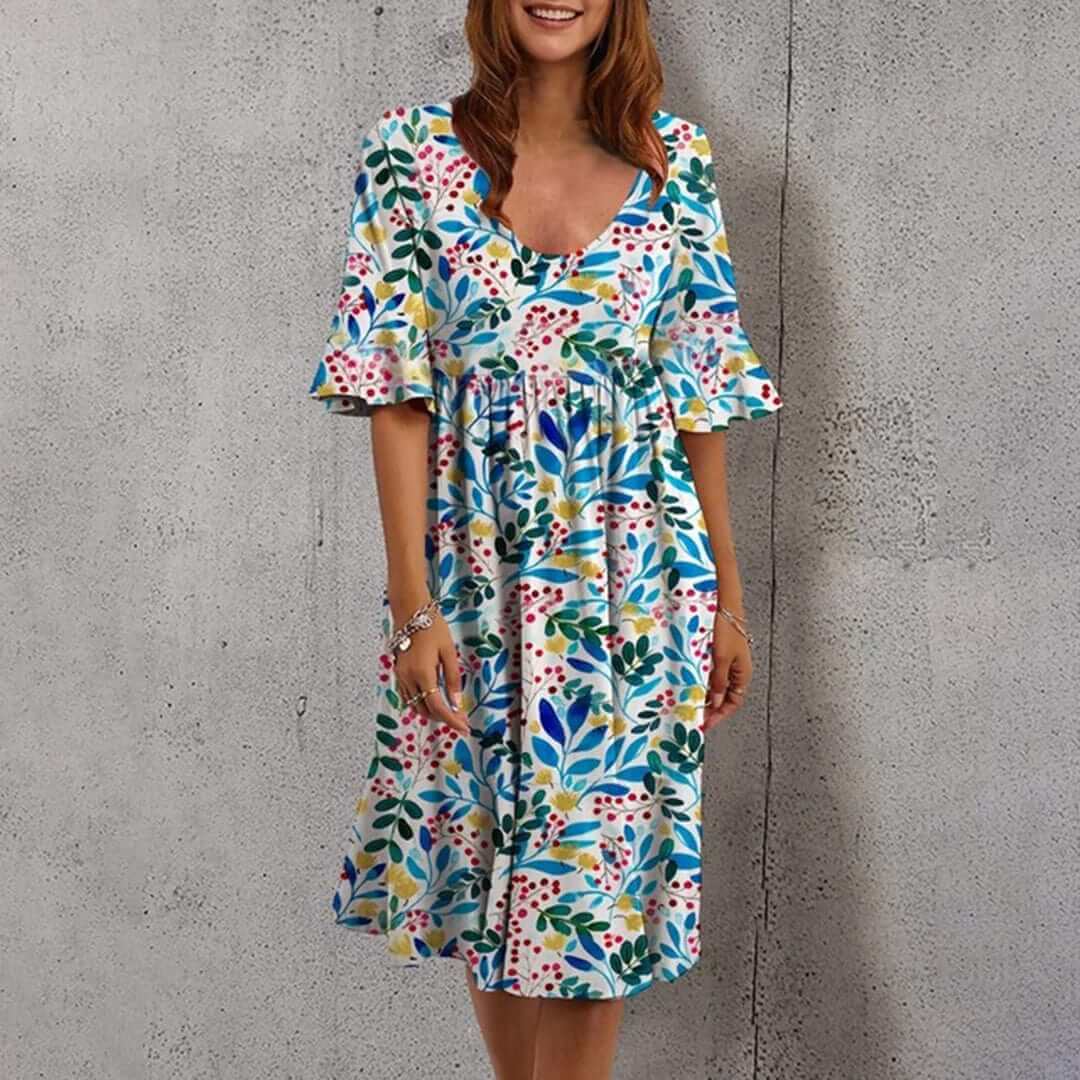 Effortless flowy floral midi dress for women, a chic sleeveless design perfect for summer and resort wear.