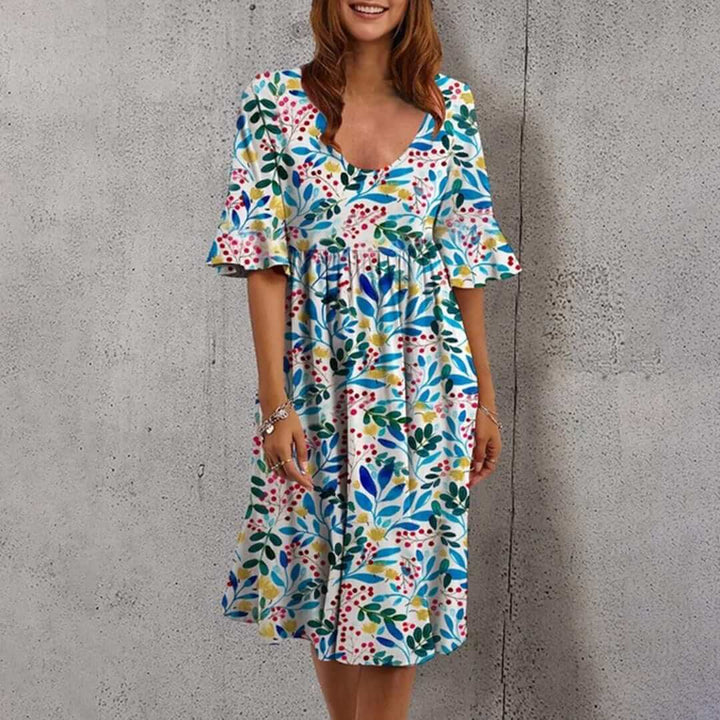 Effortless flowy floral midi dress for women, a chic sleeveless design perfect for summer and resort wear.
