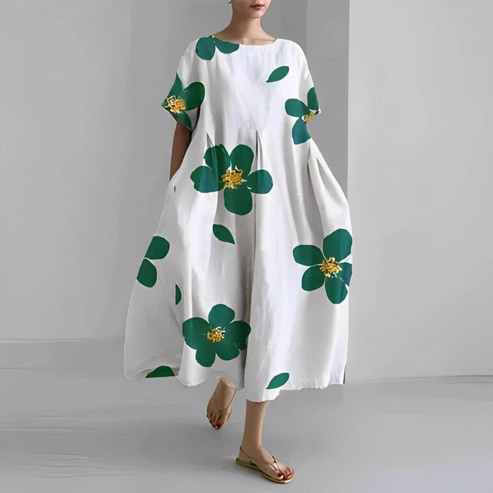 Flowy women's floral print swing dress, a comfortable boho style for summer outings.