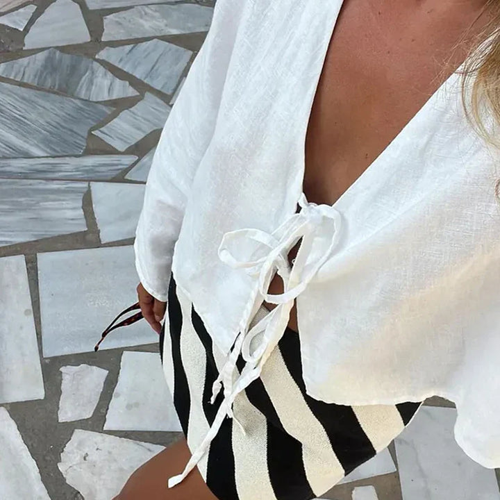 Feminine pink front-tie crop top, a breezy and comfortable summer blouse.