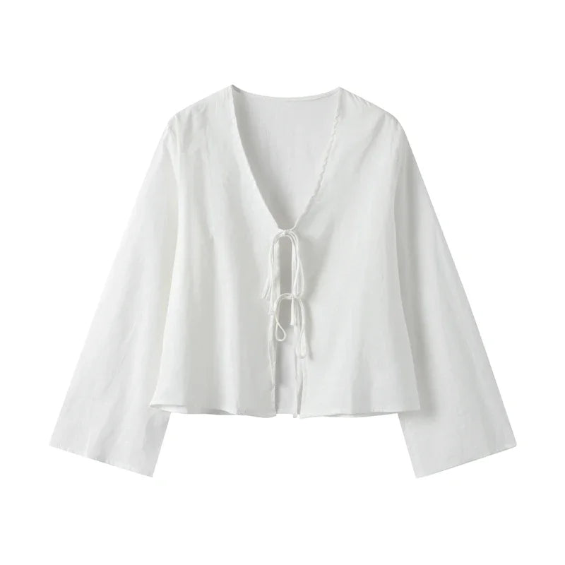 Versatile white women's crop top with a front-tie, perfect for casual or vacation wear.