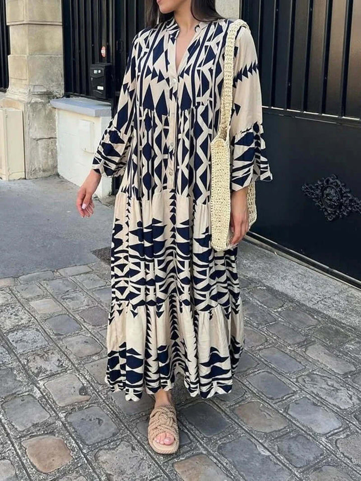 Flowy women's geometric maxi dress with V-neck, perfect comfortable attire for summer vacations.