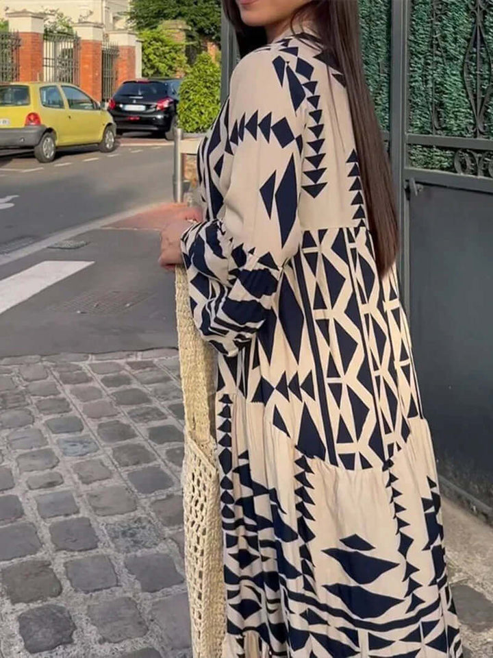 Plus size women's elegant geometric print maxi dress with V-neck, comfortable for all-day wear.