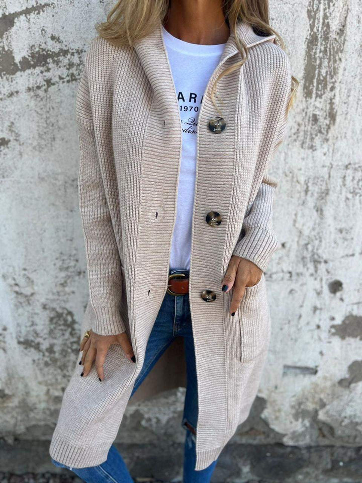 Chic women's long button cardigan, ideal for versatile layering. Effortless, cozy outerwear for fall & spring fashion.