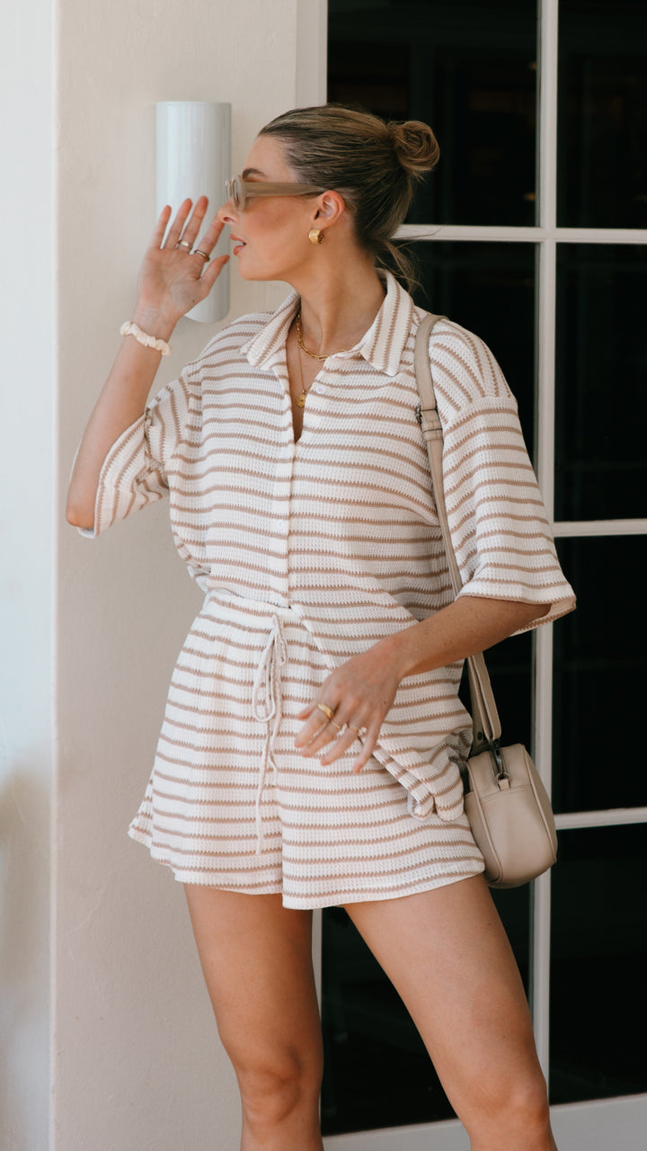 Stylish women's matching striped top and shorts set, perfect for beachwear, vacation, and sunny day fashion.