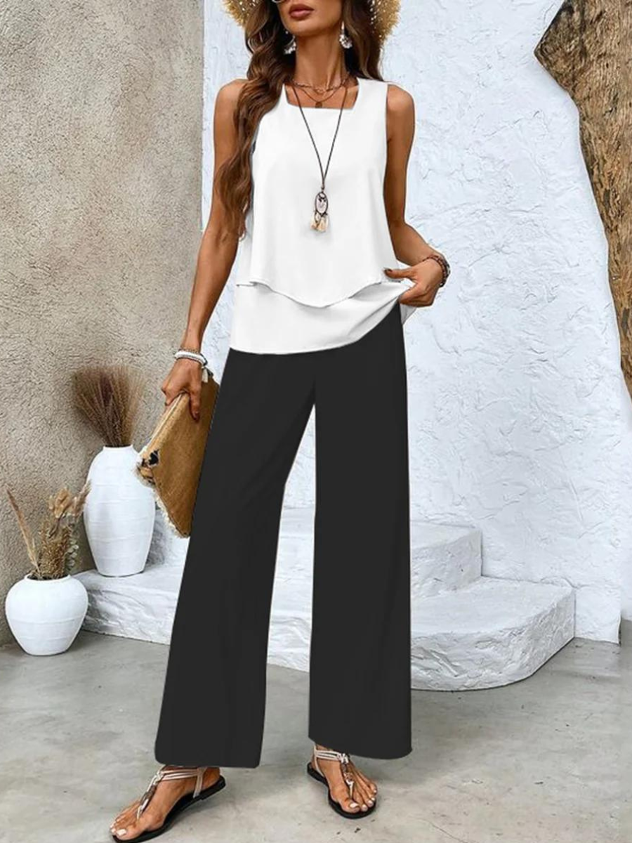 Chic women's two-piece summer set, includes a layered top & comfortable wide-leg pants. Great for leisure.