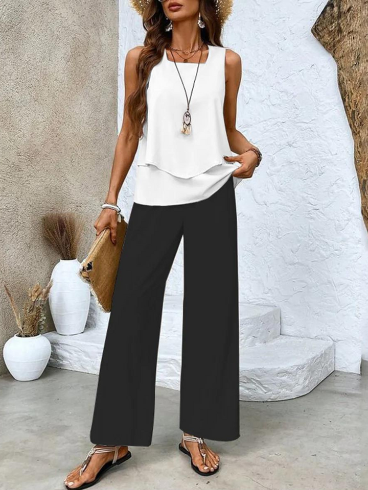 Chic women's two-piece summer set, includes a layered top & comfortable wide-leg pants. Great for leisure.