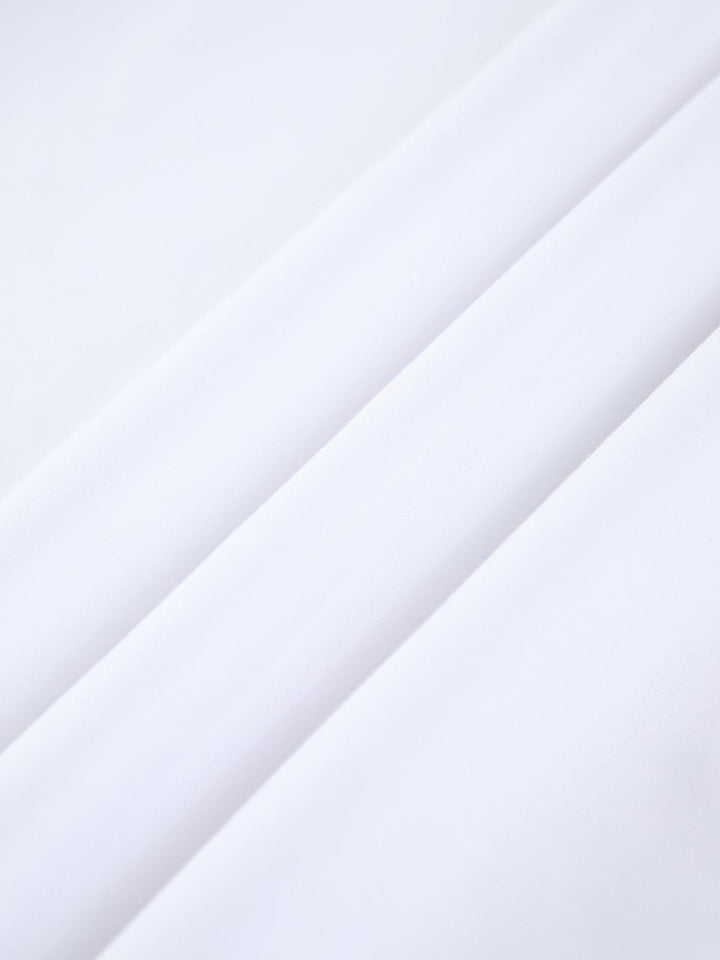 Women's comfortable white linen midi dress. A breathable summer fashion staple, perfect for versatile daily elegance.