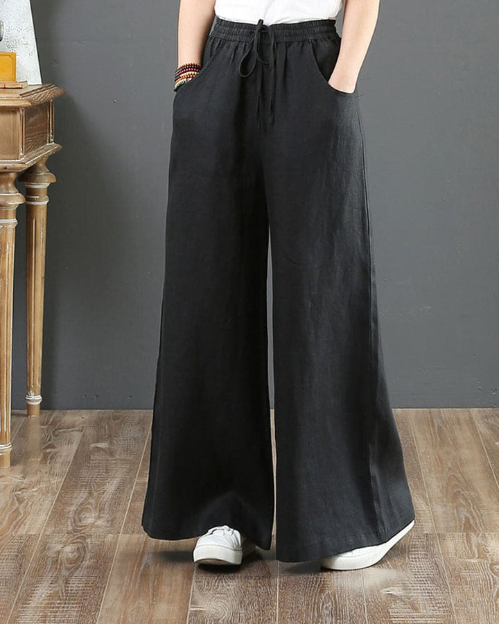 Close-up of women's wide leg drawstring trousers, highlighting the comfortable elastic waist & stylish tie detail.