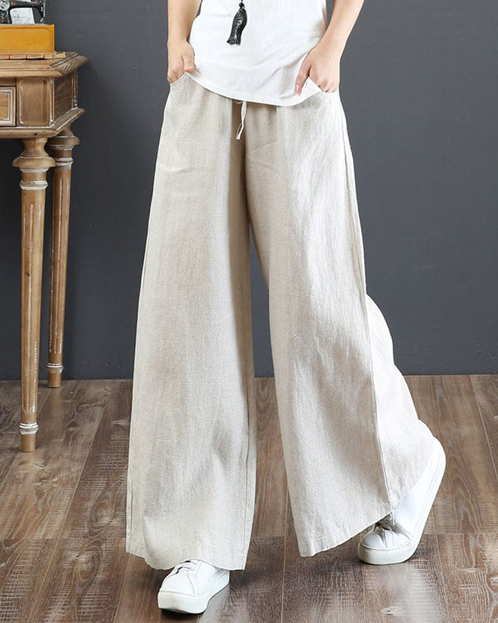 Full-length view of women's wide leg trousers, showing flowy, loose fit & comfortable design for any day.