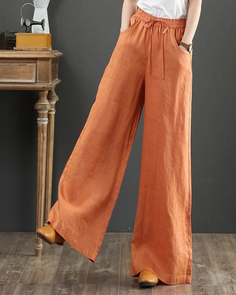 Stylish women's wide leg drawstring pants in a soft, flowy fabric. Ideal for a comfortable, chic everyday look.