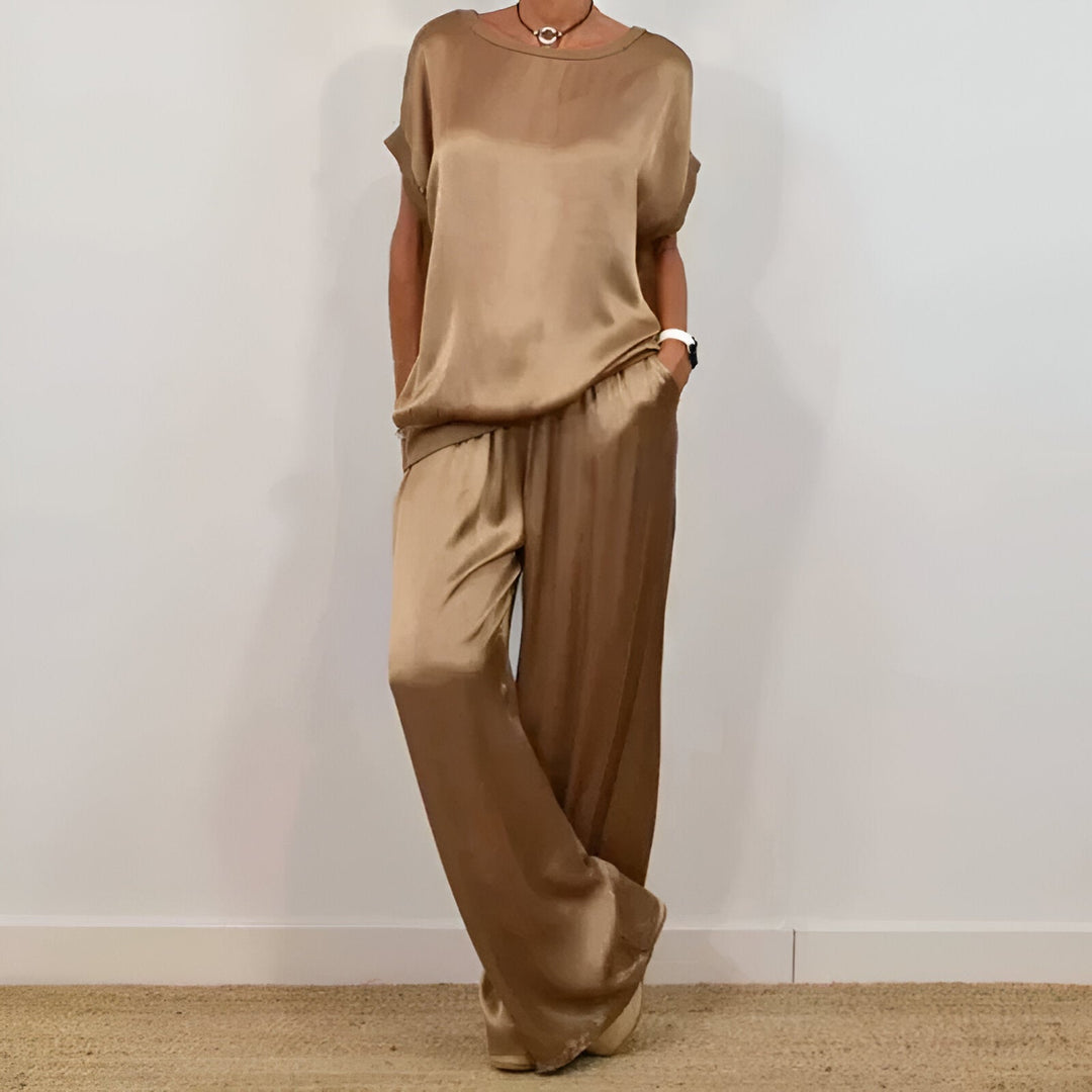 Casual women's wide-leg set, a minimalist short sleeve top and flowy wide-leg pants for effortless comfort.