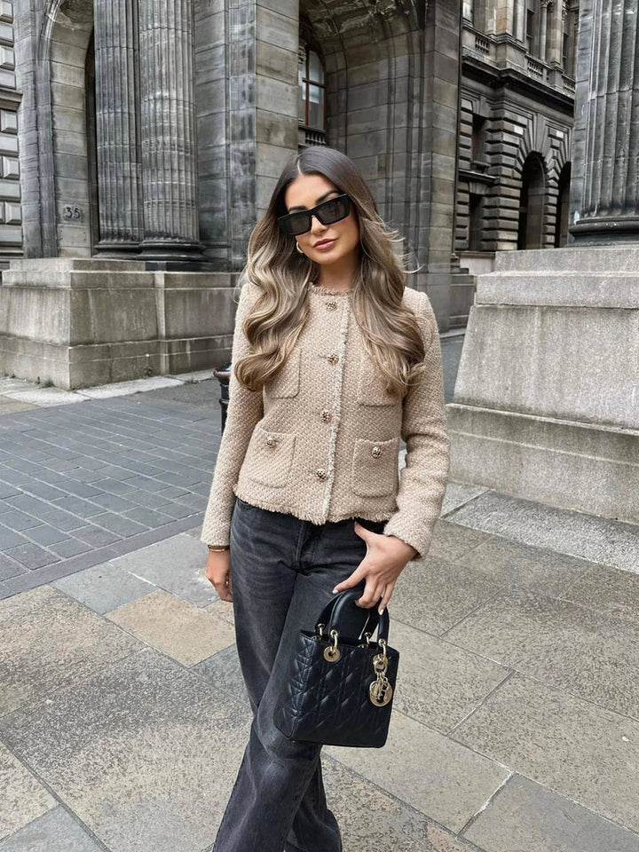 Sophisticated women's classic tweed outerwear jacket with dazzling gold buttons for an elegant look.