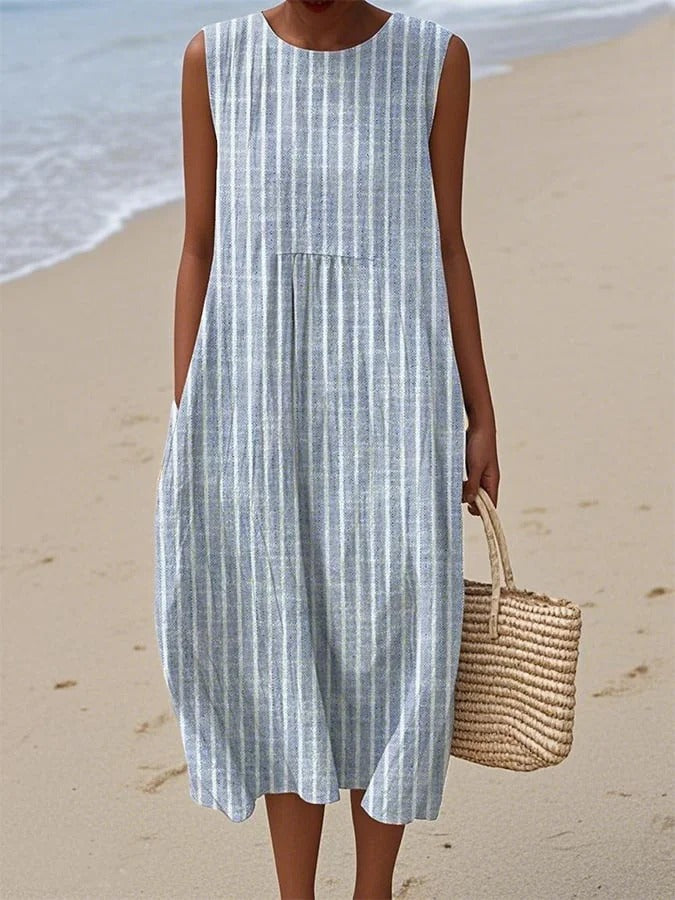 Women's elegant blue midi dress, timeless and flattering for versatile formal or casual chic spring/summer wear.