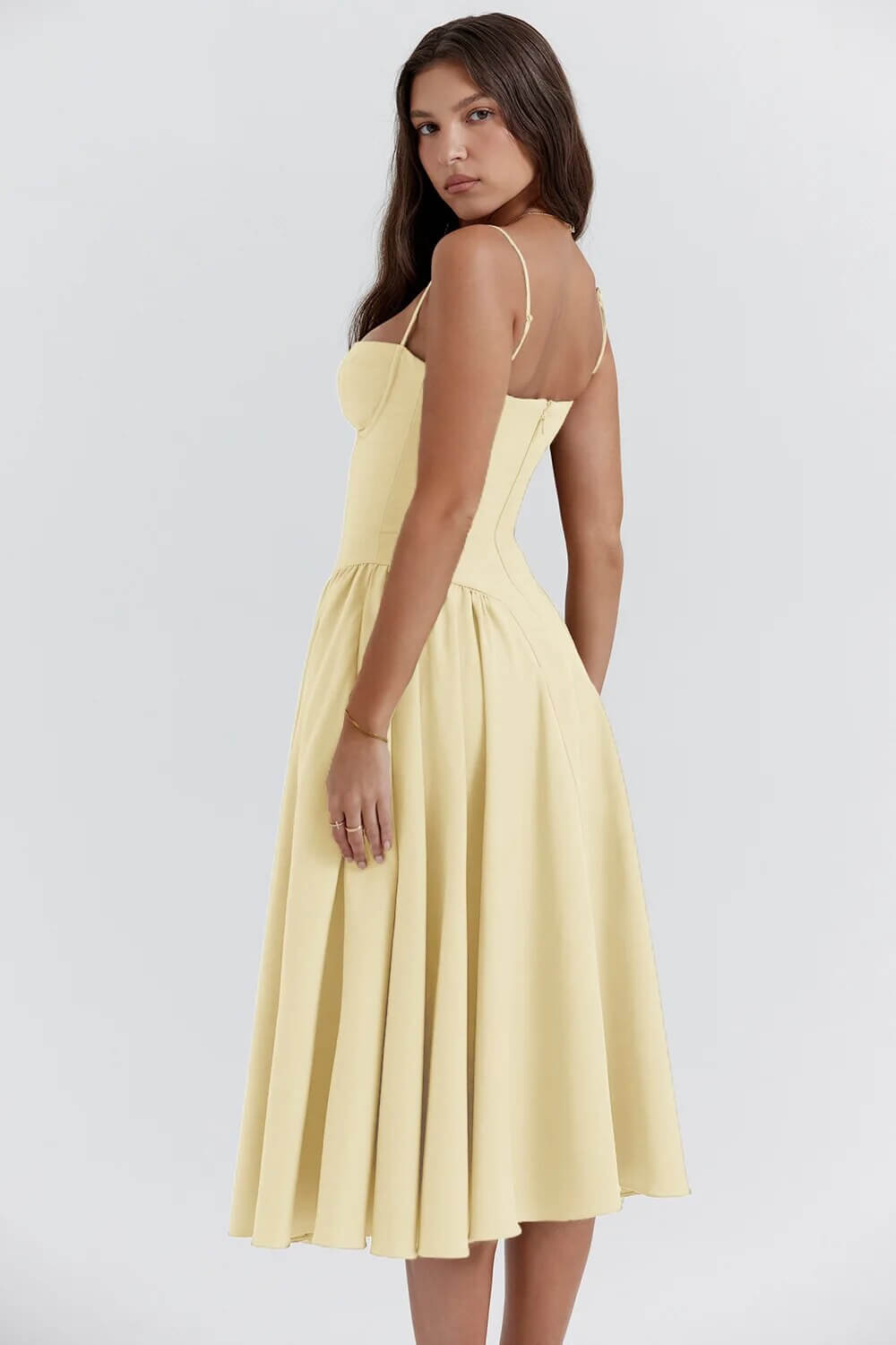 Close-up of the elegant corset detail on a women's flattering sleeveless midi dress.
