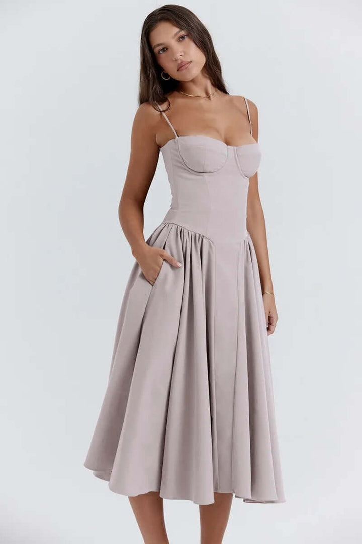 Model wearing a women's elegant sleeveless corset midi dress, perfect for chic fashion.