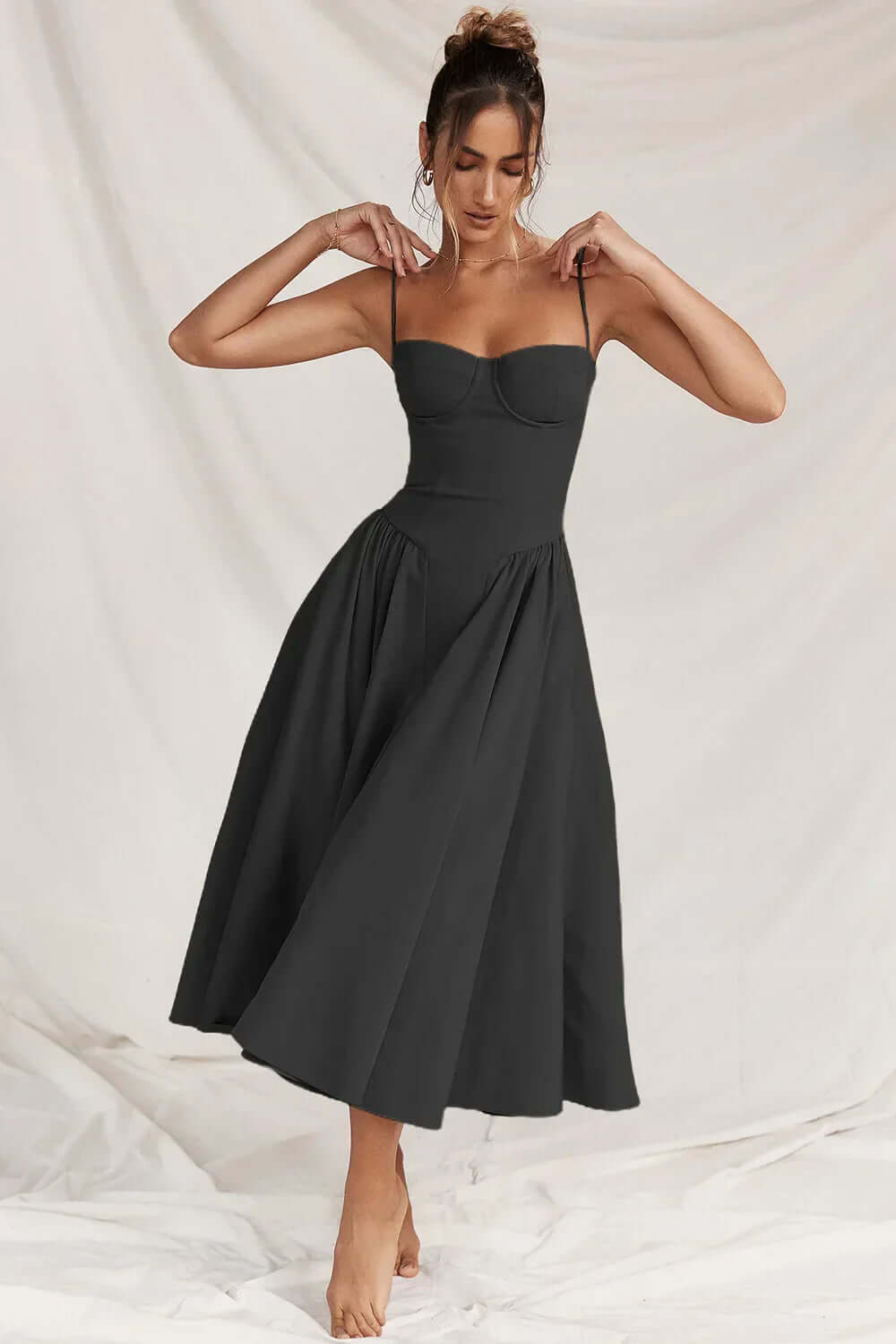 Party-ready women's elegant midi dress, sleeveless corset design for a chic look.