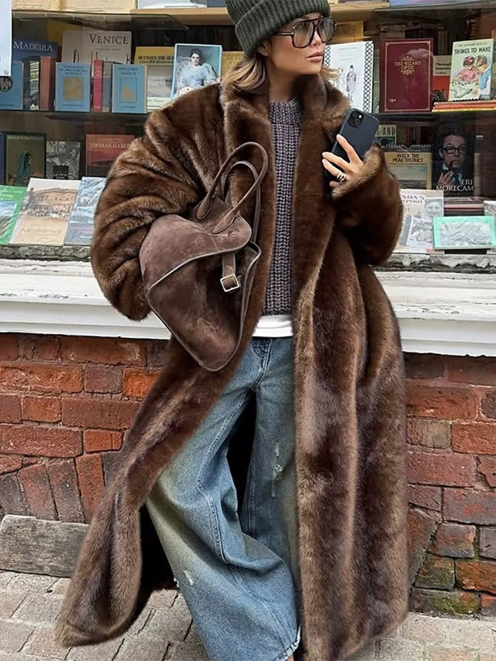 Women's elegant dark brown long winter coat, warm oversized outerwear for cold weather fashion.
